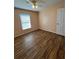 Bedroom featuring a ceiling fan, natural light, and hardwood-style floors at 3722 S Cranberry Blvd, North Port, FL 34286