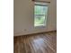 Bedroom with wood floors and a window at 3722 S Cranberry Blvd, North Port, FL 34286