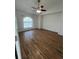 Bedroom with large window offering natural light and hardwood-style floors at 3722 S Cranberry Blvd, North Port, FL 34286