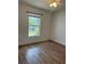 Bedroom with hardwood floors, a ceiling fan, and a window at 3722 S Cranberry Blvd, North Port, FL 34286