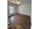 Bedroom with wood floors, a ceiling fan, and a window at 3722 S Cranberry Blvd, North Port, FL 34286