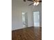 A spacious bedroom with two open doorways, a bathroom, and a bedroom at 3722 S Cranberry Blvd, North Port, FL 34286