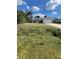 Quaint single-story home with an attached two-car garage and arched entryway at 3722 S Cranberry Blvd, North Port, FL 34286