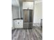 Kitchen view featuring a stainless steel refrigerator, and white cabinets at 3722 S Cranberry Blvd, North Port, FL 34286