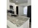 A spacious kitchen features white cabinets and stainless steel appliances at 3722 S Cranberry Blvd, North Port, FL 34286