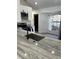 Modern kitchen with gray countertops, stainless steel appliances, and ample natural light from a window at 3722 S Cranberry Blvd, North Port, FL 34286