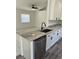 Bright kitchen with granite countertops, modern appliances, and adjacent living area at 3722 S Cranberry Blvd, North Port, FL 34286
