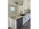 Bright kitchen with granite countertops, modern appliances, and adjacent living area at 3722 S Cranberry Blvd, North Port, FL 34286