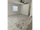Inviting living room with tile flooring, connecting to a kitchen countertop at 3722 S Cranberry Blvd, North Port, FL 34286