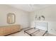 Neutral bedroom with woven furniture offers a serene escape, and the spacious closet maximizes storage at 3864 Chatsworth Greene Ct # 10, Sarasota, FL 34235