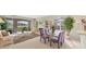 Open-concept living and dining area featuring ample space, golf course views, and neutral colors at 3864 Chatsworth Greene Ct # 10, Sarasota, FL 34235