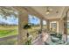 Relaxing screened lanai featuring comfortable seating and beautiful views of the lush golf course at 3864 Chatsworth Greene Ct # 10, Sarasota, FL 34235