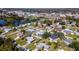Scenic aerial view of the community, featuring lush greenery and a tranquil lake at 4210 Pandora Rd, Venice, FL 34293