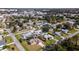 Suburban neighborhood showcasing single-Gathering homes, mature trees, and convenient access to commercial areas at 4210 Pandora Rd, Venice, FL 34293
