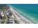 Expansive aerial view showcasing the beach and the stunning turquoise ocean at 4210 Pandora Rd, Venice, FL 34293