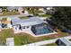 Aerial view of home with a screened-in pool, fenced yard, and updated metal roof at 4210 Pandora Rd, Venice, FL 34293