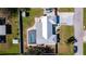 Aerial view of a home with a fenced yard, in-ground swimming pool, driveway, and neighborhood at 4210 Pandora Rd, Venice, FL 34293