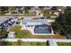 Aerial view of a fenced backyard, screened pool, and landscaping offering privacy and leisure at 4210 Pandora Rd, Venice, FL 34293