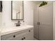 Modern bathroom features a stylish vanity, ample storage within shaker cabinets, and modern fixtures at 4210 Pandora Rd, Venice, FL 34293