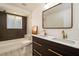 Elegant bathroom featuring double sinks, stylish fixtures, and a tiled shower at 4210 Pandora Rd, Venice, FL 34293