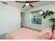 Bright bedroom featuring a ceiling fan, bright window, and a modern style at 4210 Pandora Rd, Venice, FL 34293