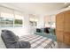Comfortable bedroom setup, featuring a well-lit desk area, modern wardrobe, and calming neutral tones at 4210 Pandora Rd, Venice, FL 34293