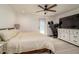 Bright bedroom featuring a ceiling fan, and a white dresser with a TV at 4210 Pandora Rd, Venice, FL 34293