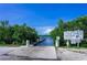 South Venice Beach boat ramp bordered by green trees leading to calm blue waters at 4210 Pandora Rd, Venice, FL 34293