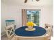 Bright dining area featuring a round table with seating and sliding glass doors to let natural light flood the space at 4210 Pandora Rd, Venice, FL 34293