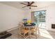 Charming dining area, featuring a stylish round table, comfortable seating, and views of the pool area at 4210 Pandora Rd, Venice, FL 34293