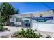 Charming South Venice Beach Ferry entrance with lush greenery under a bright blue sky at 4210 Pandora Rd, Venice, FL 34293