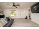 Bright living room with stylish gray floors and comfortable seating area at 4210 Pandora Rd, Venice, FL 34293