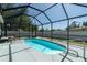 Inviting screened-in pool area with a sleek, modern design perfect for relaxation at 4210 Pandora Rd, Venice, FL 34293