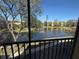 The screened-in balcony offers serene views of the pond, fountain, and lush landscaping at 435 30Th W Ave # D303, Bradenton, FL 34205