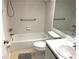 Bathroom features a toilet, sink, shower and tub, and tile flooring at 435 30Th W Ave # D303, Bradenton, FL 34205