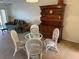 Bright dining area with a wooden hutch and glass table at 435 30Th W Ave # D303, Bradenton, FL 34205