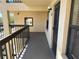 Welcoming entrance to the unit with a door, sidelight window, and exterior lighting at 435 30Th W Ave # D303, Bradenton, FL 34205