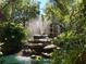 Picturesque fountain surrounded by lush greenery and mature trees at 435 30Th W Ave # D303, Bradenton, FL 34205