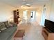 Spacious living room featuring neutral tones, a ceiling fan, and a comfortable sofa at 435 30Th W Ave # D303, Bradenton, FL 34205