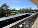 Scenic view of covered parking near a tranquil pond and lush landscaping at 435 30Th W Ave # D303, Bradenton, FL 34205
