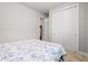 Bedroom with a large bed, closet, and carpeted floors at 44325 Saddlewood Ct, Punta Gorda, FL 33982