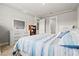 Bright bedroom featuring a queen-size bed, a dresser, and neutral tones for a relaxing atmosphere at 44325 Saddlewood Ct, Punta Gorda, FL 33982