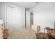 Carpeted bedroom with closet, dresser, and chair at 44325 Saddlewood Ct, Punta Gorda, FL 33982