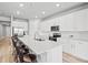 Modern kitchen boasts stainless appliances, white cabinets, and a large center island at 44325 Saddlewood Ct, Punta Gorda, FL 33982