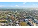 Expansive aerial view of a coastal community with waterways, residential homes, and city views at 4710 Gleason Ave, Sarasota, FL 34242