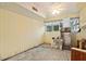 Unfinished basement with concrete floor, window, and ceiling fan at 4710 Gleason Ave, Sarasota, FL 34242