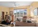 Bedroom featuring large windows, ceiling fan, and air conditioner at 4710 Gleason Ave, Sarasota, FL 34242