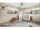 Bedroom with a ceiling fan, three windows, and an air conditioning unit at 4710 Gleason Ave, Sarasota, FL 34242