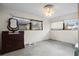 Bedroom with a ceiling fan, two windows, and an antique dresser at 4710 Gleason Ave, Sarasota, FL 34242