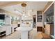 Spacious kitchen with white cabinetry, tile flooring, ample counter space, and natural light at 4710 Gleason Ave, Sarasota, FL 34242